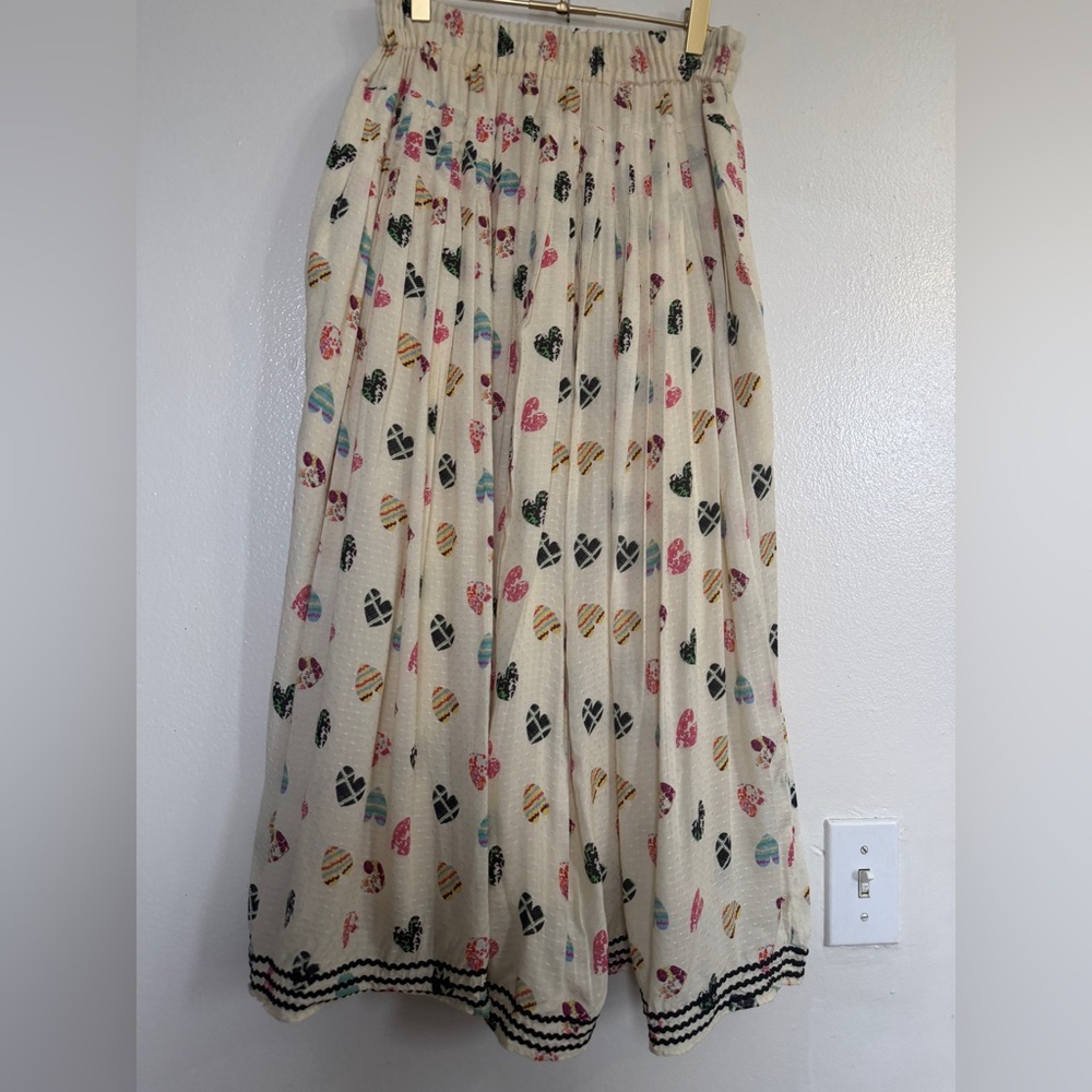 Elegant Cream Pleated mid kirt with Multicolor Print